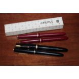FIVE PARKER FOUNTAIN PENS
two in black,