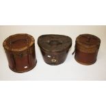 AN OLD LEATHER TOP HAT BOX,  and two oth