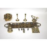 A PAIR OF BRASS CANDLESTICKS,