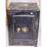 AN OLD CAST IRON FIRE PROOF SAFE, with k