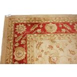 AN IVORY GROUND ZIEGLER STYLE CARPET,