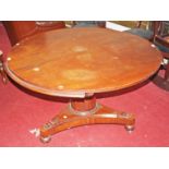 A CIRCULAR MAHOGANY BREAKFAST TABLE, The moulded top on an upward tapering cylindrical stem, with