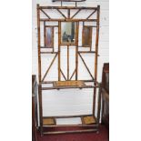 A VICTORIAN BAMBOO HALL STAND, with mirror back and two stick and umbrella compartments, 35in (