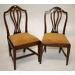 A SET OF FIVE MAHOGANY DINING CHAIRS, Each in the George III style, each with an arched top and