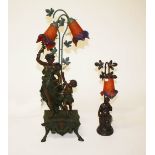 A MODERN COMPOSITION BRONZED TABLE LAMP, modelled with two classical figures, standing by a vine,