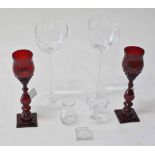 A PAIR OF RUBY GLASS CANDLE HOLDERS,   E