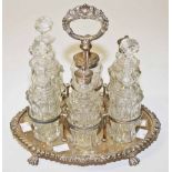 AN OVAL SILVER PLATED CRUET STAND,   wit