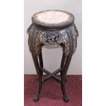 A TALL CARVED AND PIERCED ORIENTAL HARDWOOD JARDINIERE STAND, with mother o' pearl inlay and