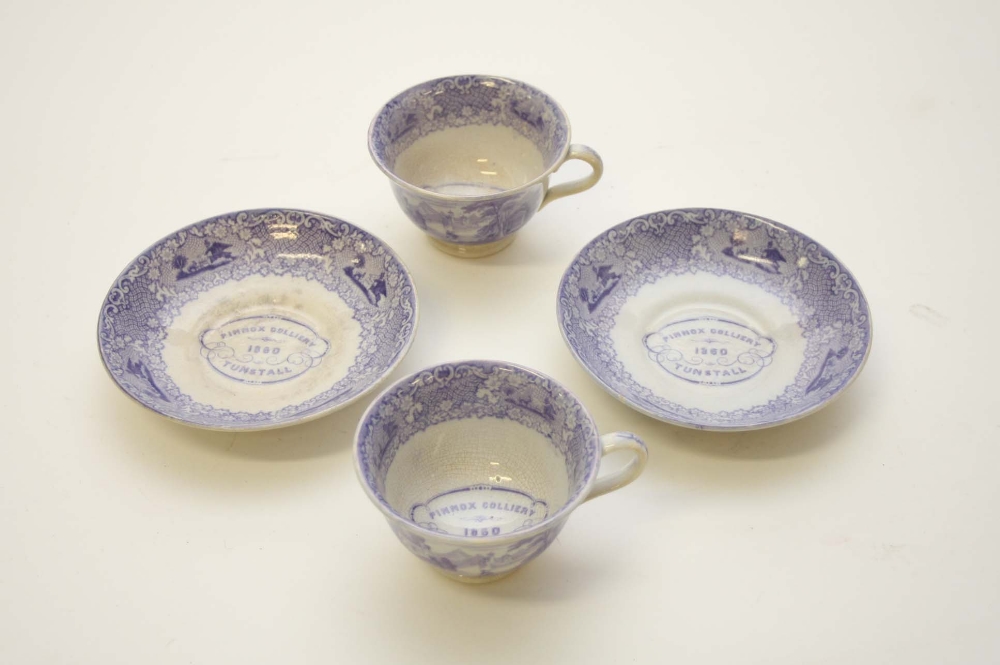 A PAIR OF BLUE AND WHITE TUNSTALL CUPS AND SAUCERS, commemorating Pinox Culiery 1860. (4)