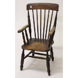 AN OLD ELM AND ASH STICK BACK KITCHEN ARMCHAIR, with solid seat. (1)