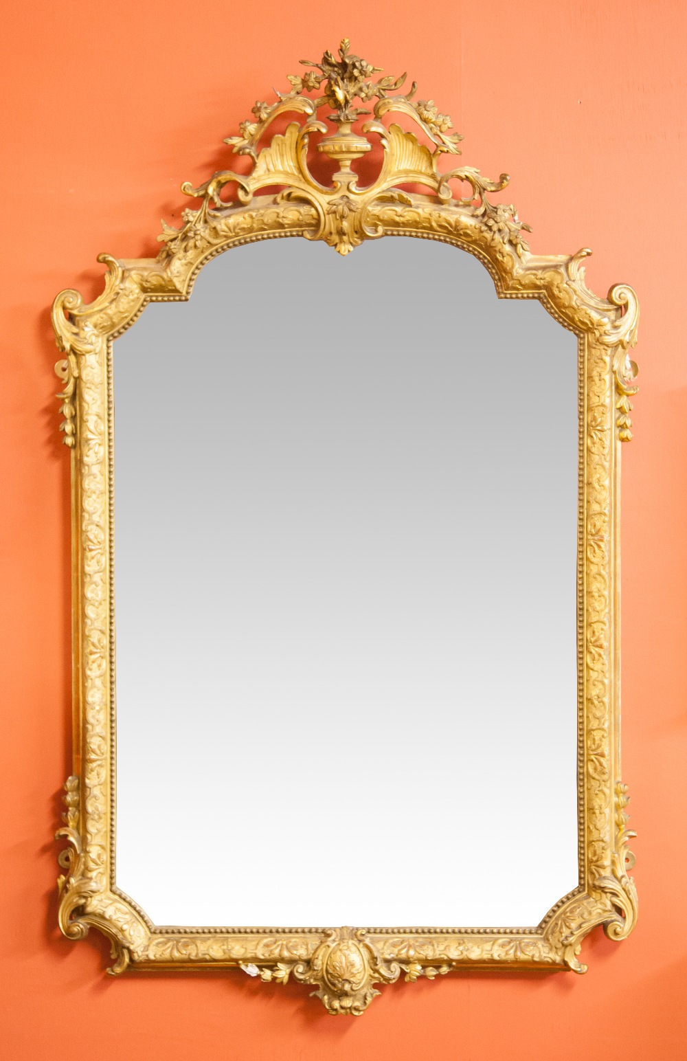 A VERY ATTRACTIVE LATE 19TH CENTURY GILT AND GESSO PIER OR WALL MIRROR, the arched top crested