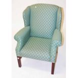 A GEORGIAN STYLE WING ARMCHAIR,   O.R.M,