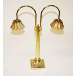 A BRASS TWO BRANCH LIBRARY DESK LIGHT, with gilt shade, 25in (64cm). (1)