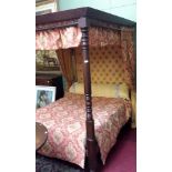 A MAHOGANY FOUR POSTER CANOPY BED, draped in attractive gold fabric with padded headboard and