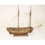 A WOODEN SCALE MODEL OF A DOUBLE MAST SCHOONER, with riggings, wooden deck with six cannon guns,