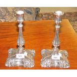 A PAIR OF SILVER PLATED CANDLESTICKS,