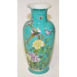 A BALUSTER SHAPED TURQUOISE GROUND VASE,