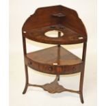 A 19TH CENTURY BOW FRONTED MAHOGANY CORNER WASH STAND , with a tall gallery, above a pierced shelf