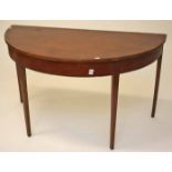 A MAHOGANY DEMI LUNE SIDE TABLE, late 19th century early 20th century, on four square tapering legs,