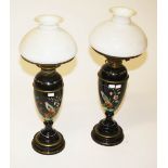 A GOOD PAIR OF VICTORIAN DARK GLASS, ENAMEL DECORATED AND BRASS MOUNTED OIL LAMPS, each of amphora