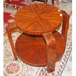 AN ATTRACTIVE TWO TIER ART DECO STYLE OCCASIONAL TABLE, with circular shelves, raised on shaped