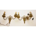A PAIR OF LEAF CAST BRASS TWO BRANCH WALL LIGHTS, each crested with an urn in an oval wreath,