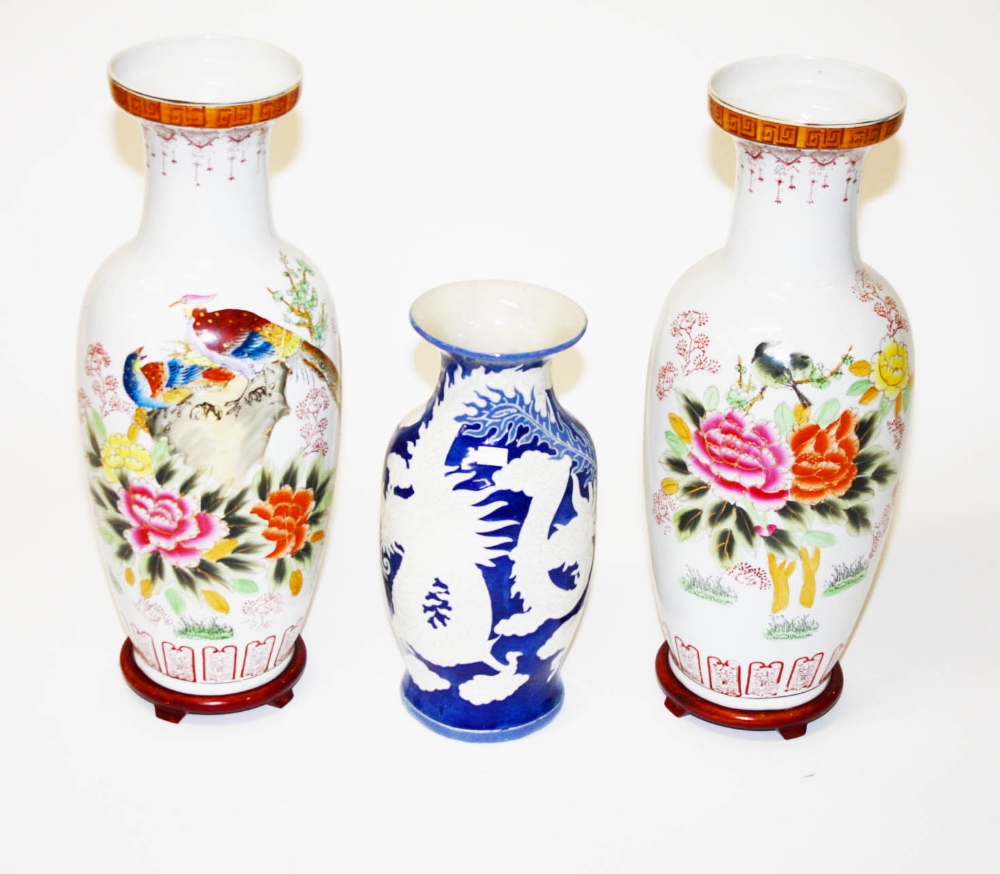 A PAIR OF MODERN CHINESE PORCELAIN VASES, each decorated with pheasants amongst flowers and foliage,