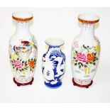A PAIR OF MODERN CHINESE PORCELAIN VASES, each decorated with pheasants amongst flowers and foliage,