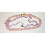 A 20" rose quartz bead Necklace, with circular stones, together with another amethyst type necklace.