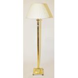 A MODERN BRASS STANDARD LAMP,