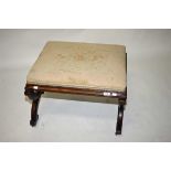 A VICTORIAN WALNUT FOOTSTOOL,  with padd