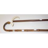 A SILVER MOUNTED BAMBOO HAND STICK,