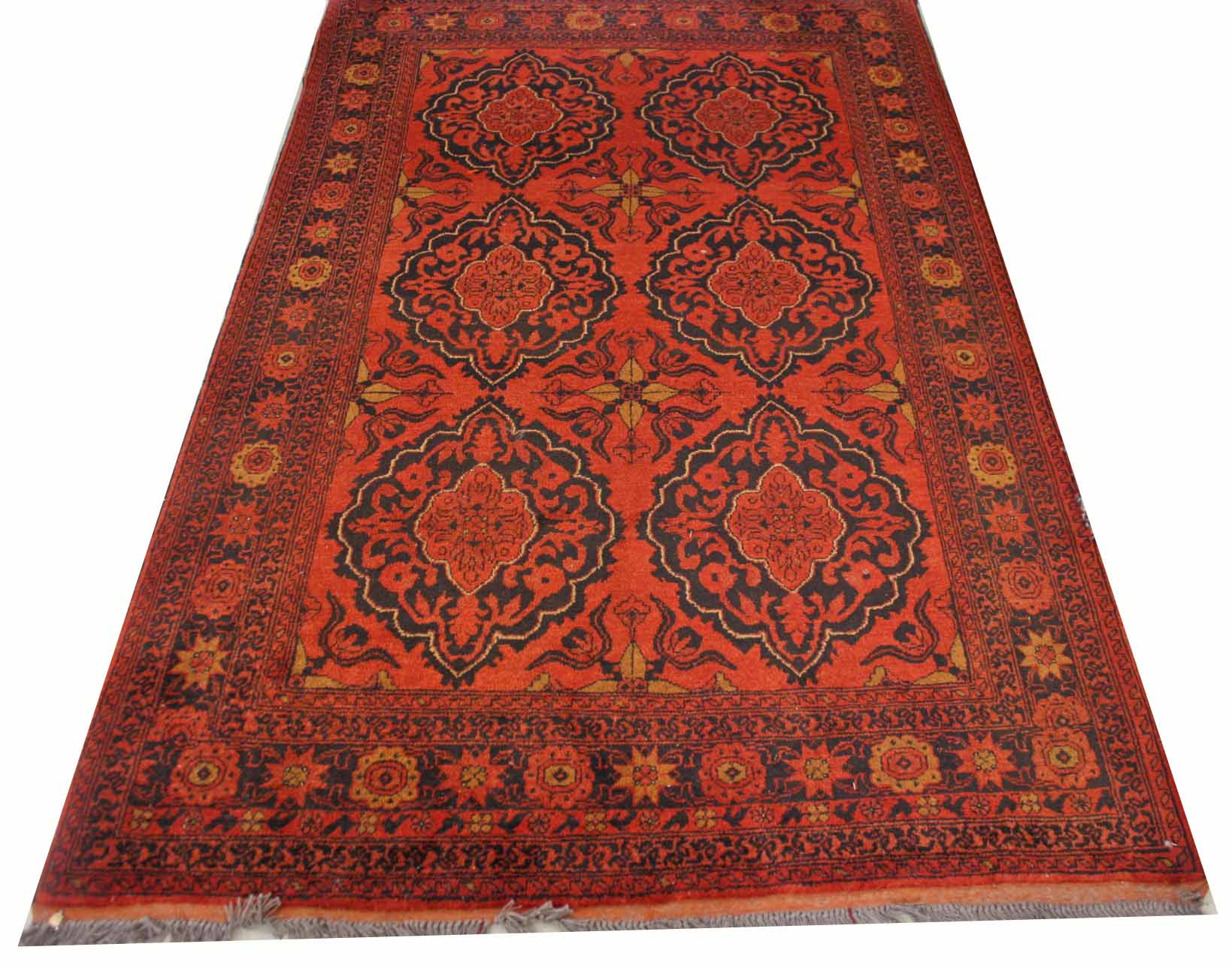 A DARK RED GROUND ORIENTAL RUG, with two rows of medallions, inside a conforming border, 80in (