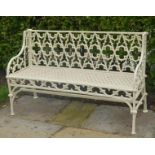 A HEAVY CREAM PAINTED CAST IRON GOTHIC STYLE GARDEN BENCH,