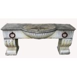 A VERY HEAVY COMPOSITION MARBLE WALL FOUNTAIN TROUGH, 
of bow front outline,