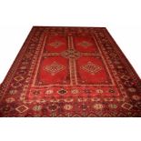 A MACHINE MADE PERSIAN STYLE RUG,