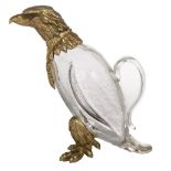 A MOULDED GLASS AND GILT METAL MOUNTED CLARET JUG, 
in the form of an eagle,
