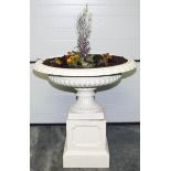 A VERY ATTRACTIVE PAIR OF LARGE CAST IRON GARDEN URNS AND PLINTHS,