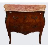 A KING WOOD AND FLORAL MARQUETRY INLAID BOMBÉ COMMODE, 
with ornate brass mounts,