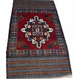 AN AFGHAN BALUCHI RUG,
with centre star medallion,