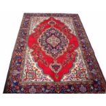 AN ALMOST MATCHING PAIR OF  TABRIZ RUGS,