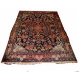 A TAFRESH RUG, 
the dark blue field with an iron red cruciform medallion,