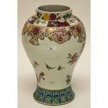 A CHINESE BALUSTER SHAPED FAMILLE ROSE PORCELAIN VASE, decorated with birds and colourful flowers,