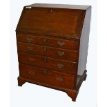 A GEORGE III MAHOGANY SLOPE FRONT BUREAU, of small proportions,