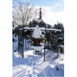 A LARGE OCTAGONAL SHAPED CAST AND WROUGHT IRON GARDEN GAZEBO,