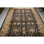 AN INDIAN HAND TUFTED WOOL CARPET,