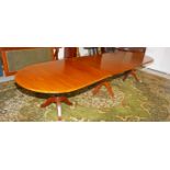 A MAHOGANY TRIPLE PEDESTAL REGENCY STYLE DINING TABLE, with demi lune ends,