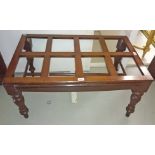 A MAHOGANY TRUNK OR SUITCASE STAND,
with railed top on turned legs, 36in (91cm)w.