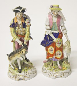 A PAIR OF CONTINENTAL PORCELAIN GROUPS,
one depicting a man with goat, the other, a woman with lamb,