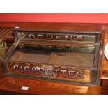 AN OCTEN'S COUNTER TOP CIGARETTE DISPLAY CASE,